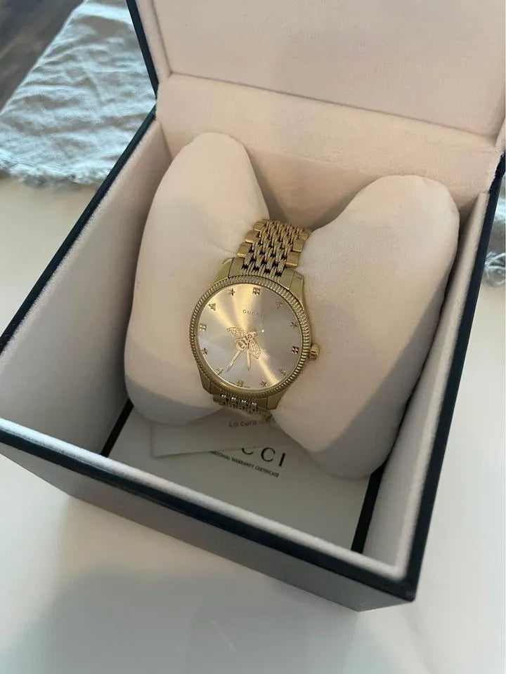 Shop Authentic Gucci G Timeless Quartz Silver Dial Gold Steel Strap Watch For Women - YA1264155 - Luxxuri