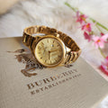  Shop Authentic Burberry The Classic Champagne Dial Gold Steel Strap Watch for Women - BU10109 - Luxxuri