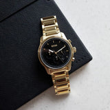  Shop Authentic Hugo Boss Trace Chronograph Black Dial Gold Steel Strap Watch For Men - 1514006 - Luxxuri