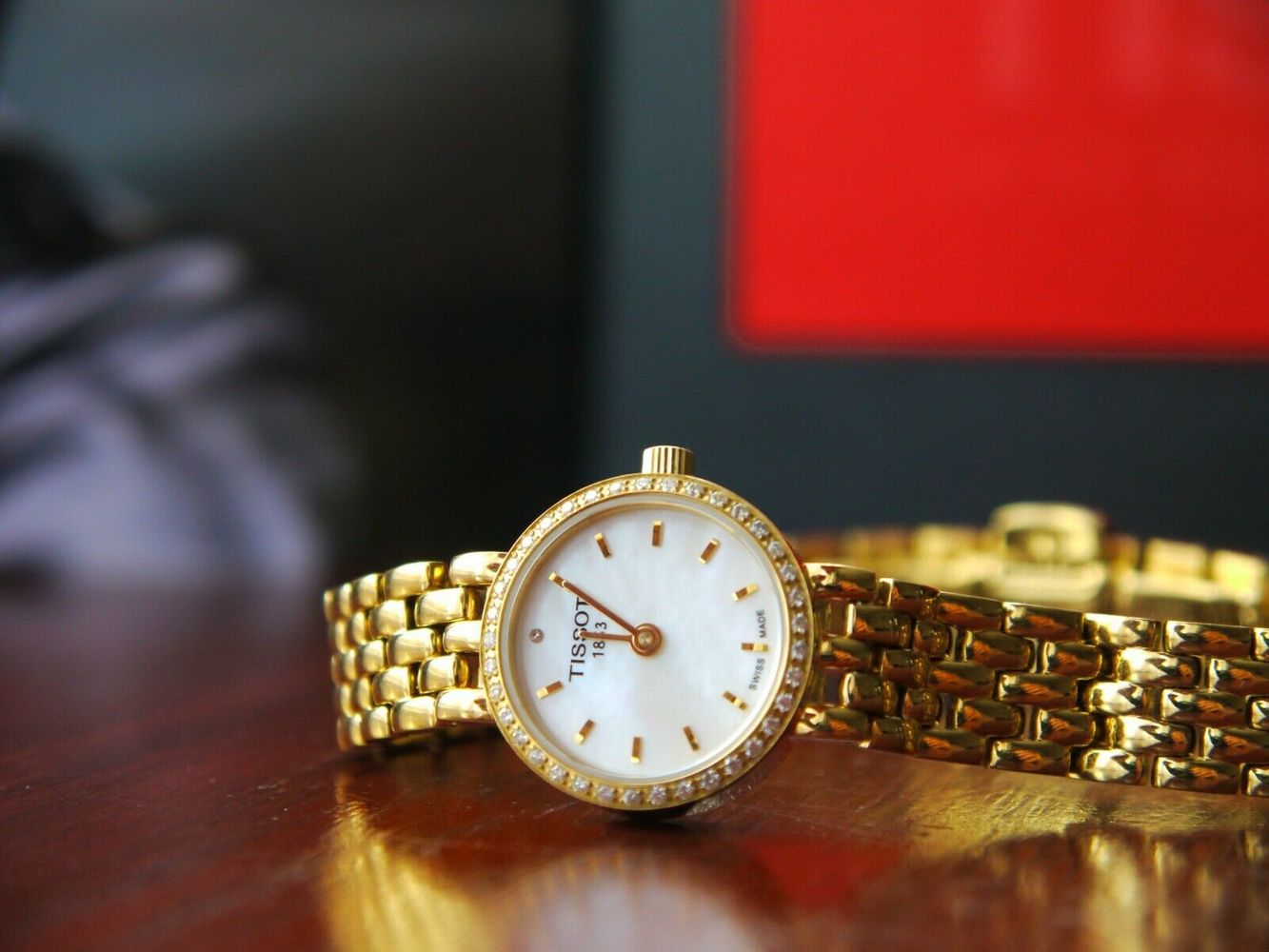  Shop Authentic Tissot T-Lady Lovely Mother of Pearl Dial Gold Steel Strap Watch For Women - T058.009.63.116.00 - Luxxuri