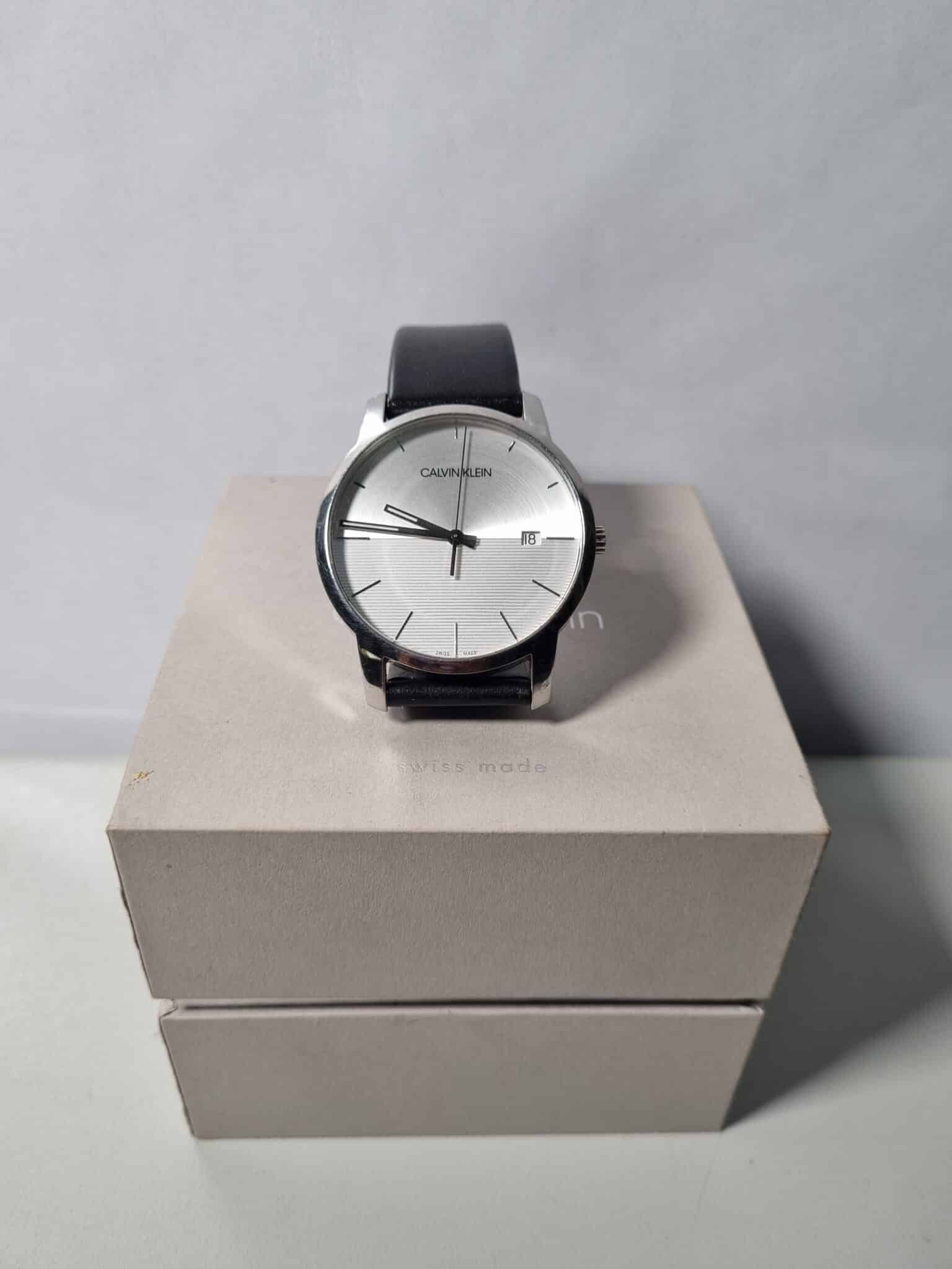  Shop Authentic Calvin Klein City White Dial Black Leather Strap Watch for Men - K2G2G1CD - Luxxuri