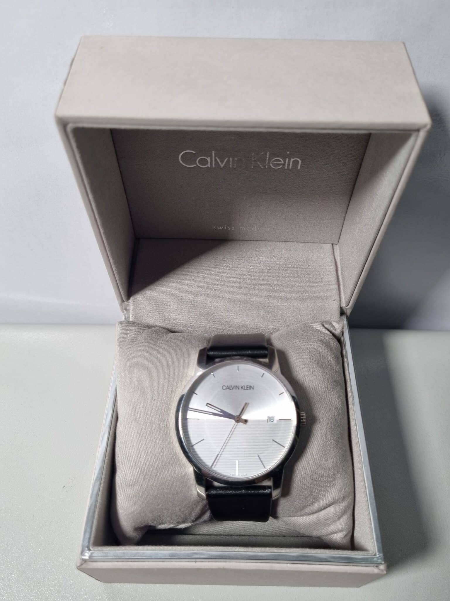  Shop Authentic Calvin Klein City White Dial Black Leather Strap Watch for Men - K2G2G1CD - Luxxuri
