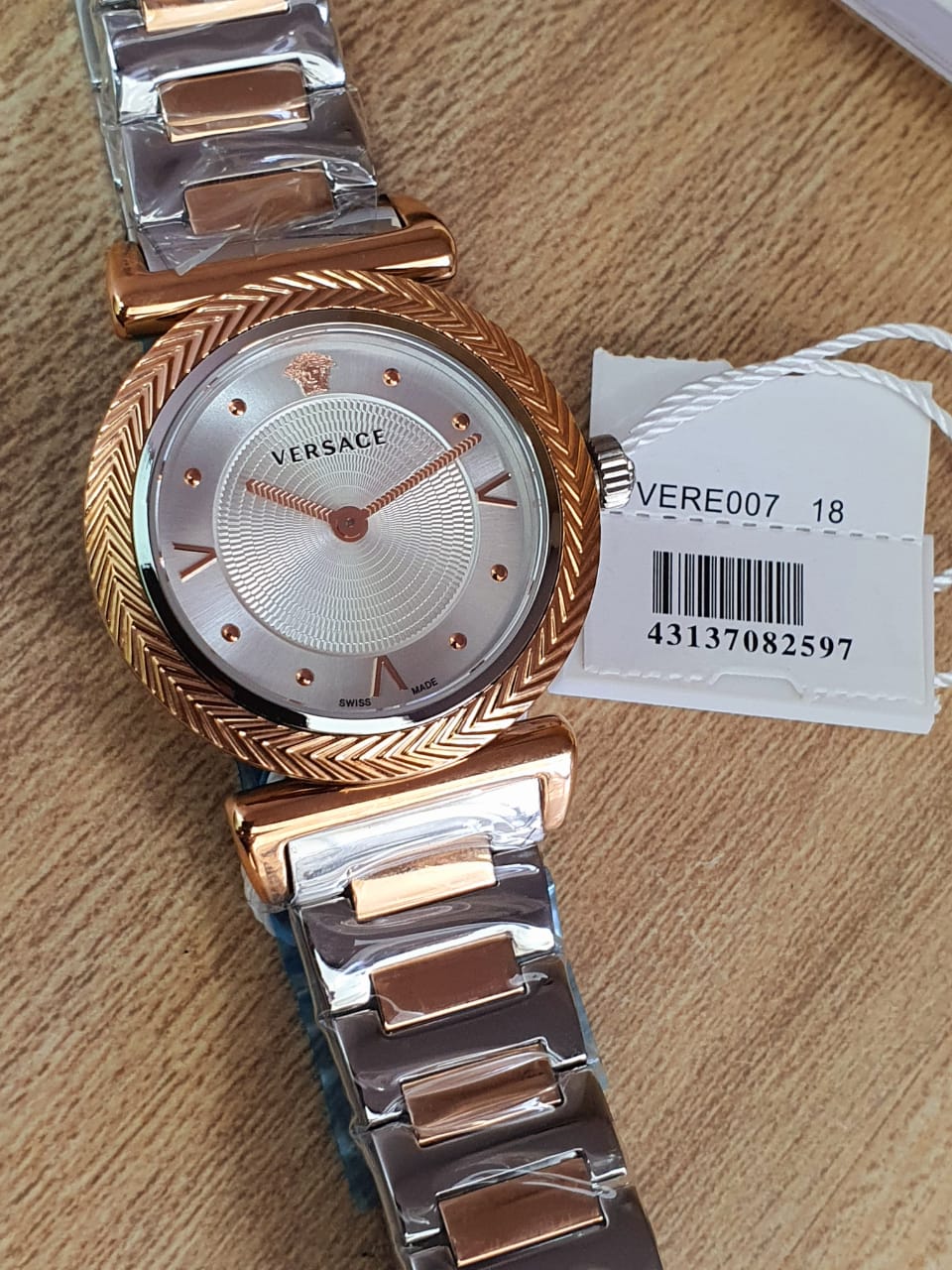  Shop Authentic Versace V-Motif Silver Dial Two Tone Steel Strap Watch for Women - VERE00718 - Luxxuri