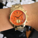  Shop Authentic Michael Kors Runway Chronograph Orange Dial Gold Steep Strap Watch For Women - MK6162 - Luxxuri