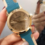 Shop Authentic Burberry The City Gold Dial Blue Leather Strap Watch for Women - BU9018 - Luxxuri