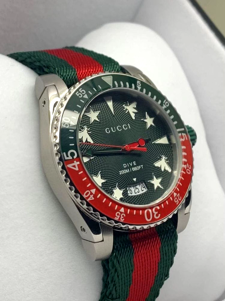  Shop Authentic Gucci Dive Quartz Green Dial Two Tone NATO Strap Watch For Men - YA136339 - Luxxuri