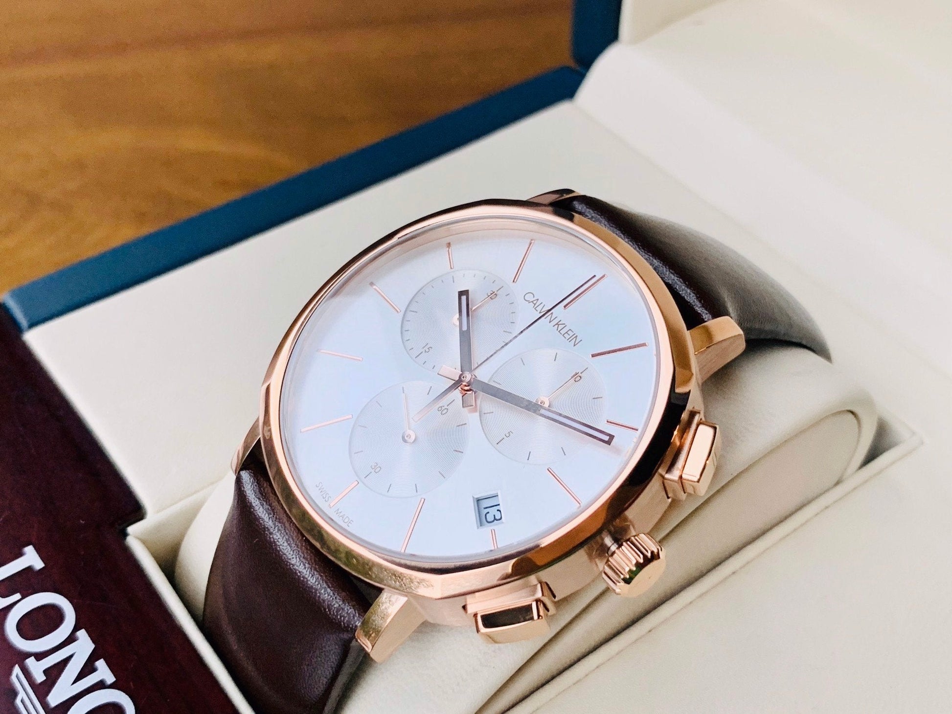  Shop Authentic Calvin Klein Posh Chronograph White Dial Brown Leather Strap Watch for Men - K8Q376G6 - Luxxuri