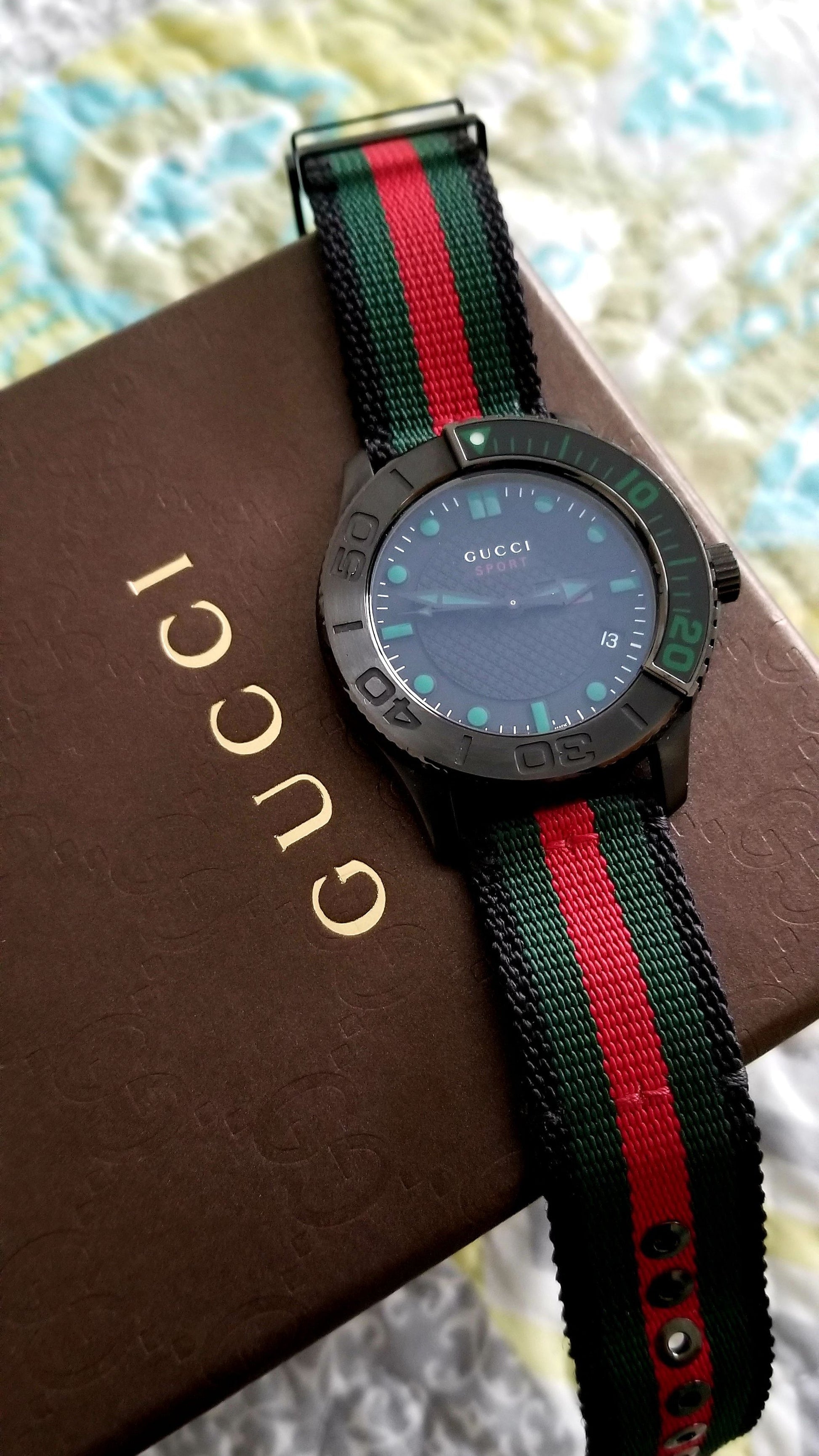  Shop Authentic Gucci G Timeless Sport Black Dial Two Tone NATO Strap Watch For Men - YA126229 - Luxxuri