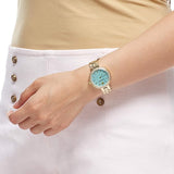  Shop Authentic Swarovski Daytime Crystals Turquoise Dial Gold Steel Strap Watch for Women - 5182212 - Luxxuri