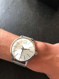  Shop Authentic Calvin Klein Post Minimal Silver Dial Black Leather Strap Watch for Men - K7621192 - Luxxuri