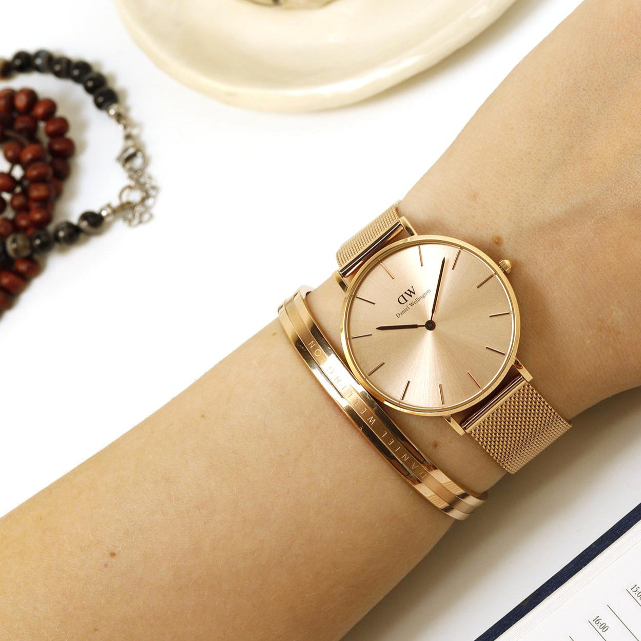  Shop Authentic Daniel Wellington Petite Rose Gold Dial Rose Gold Mesh Strap Watch For Women - DW00100472 - Luxxuri
