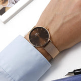  Shop Authentic Daniel Wellington Petite Amber Brown Dial Rose Gold Mesh Strap Watch for Women - DW00100478 - Luxxuri
