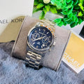  Shop Authentic Michael Kors Hunger Stop 100 Series Navy Blue Dial Silver Steel Strap Watch for Women - MK5814 - Luxxuri