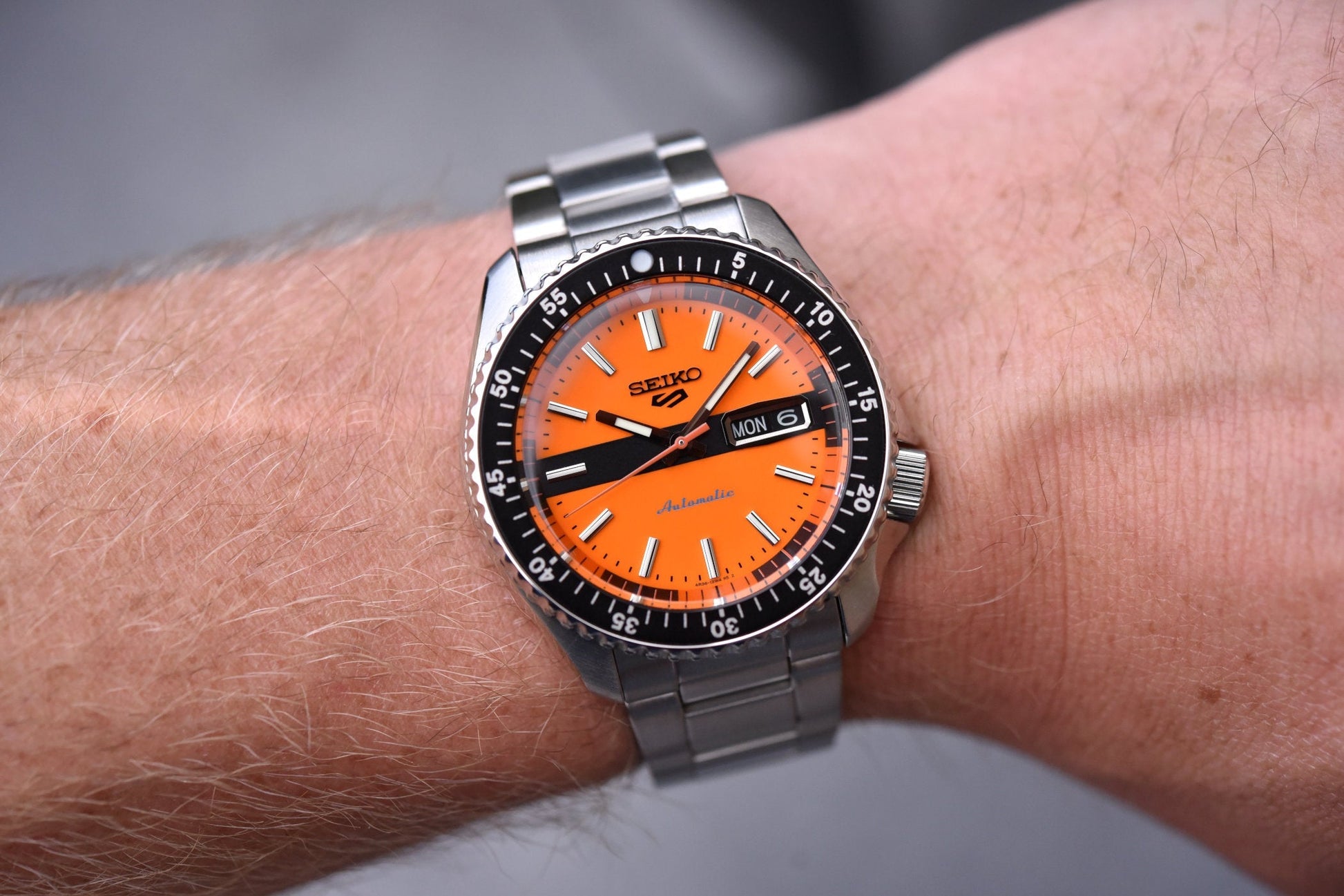  Shop Authentic Seiko 5 Sports Double Hurricane Retro Orange Dial Silver Steel Strap Watch For Men - SRPK11K1 - Luxxuri