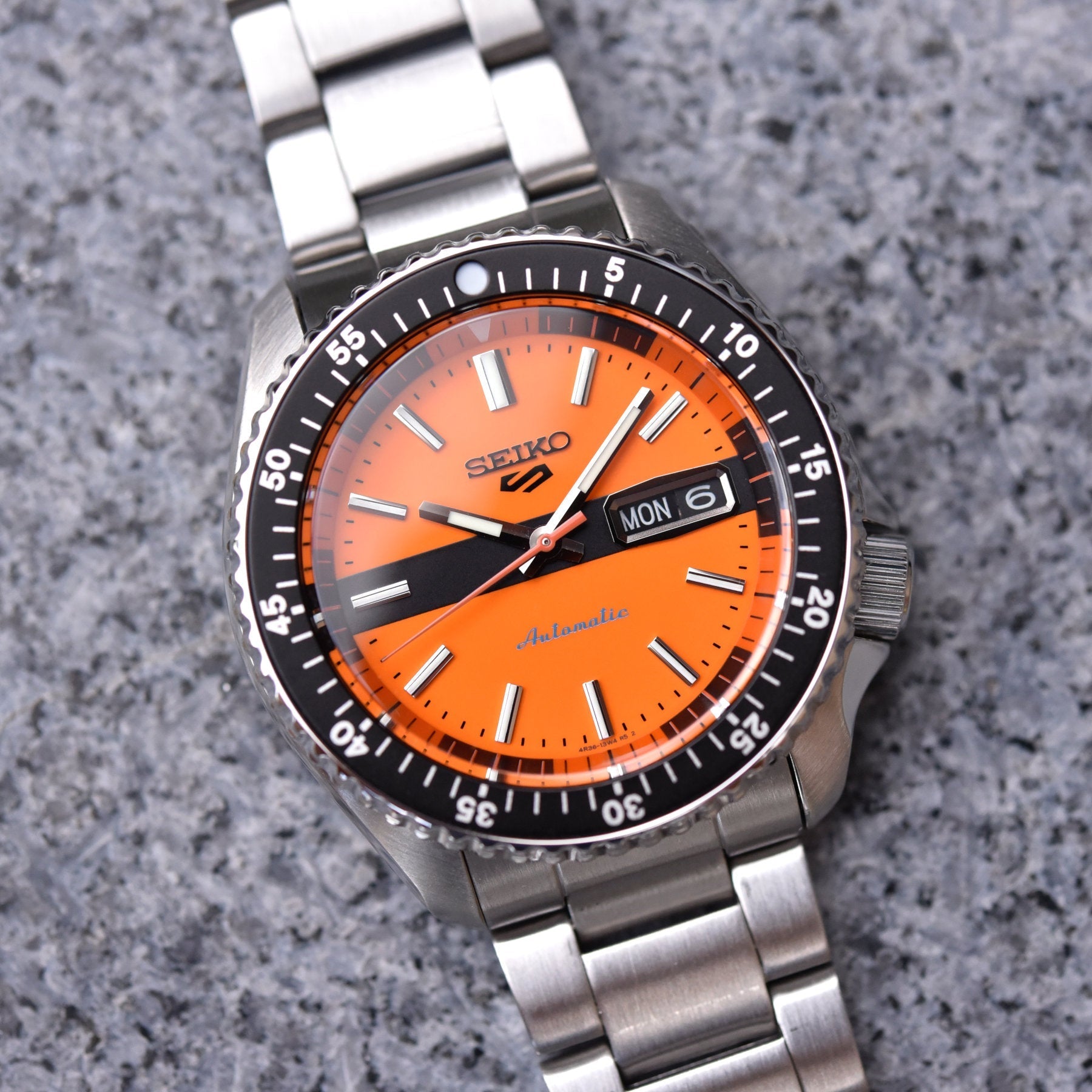 Shop Authentic Seiko 5 Sports Double Hurricane Retro Orange Dial Silver Steel Strap Watch For Men - SRPK11K1 - Luxxuri