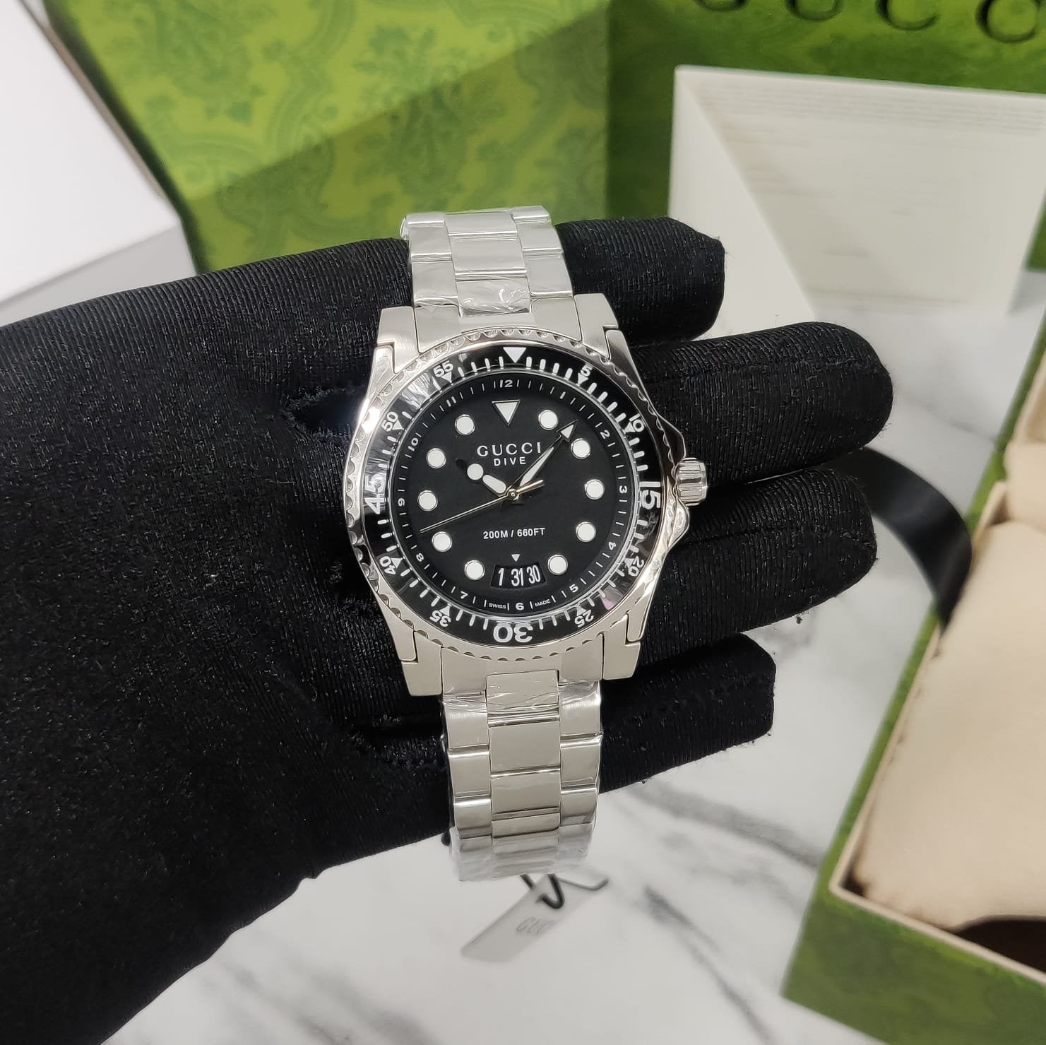  Shop Authentic Gucci Dive Quartz Black Dial Silver Steel Strap Watch For Men - YA136301B - Luxxuri