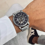  Shop Authentic Emporio Armani Meccanico Automatic Skeleton Black Dial Silver Steel Strap Watch For Men - AR60021 - Luxxuri