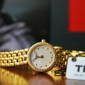  Shop Authentic Tissot T-Lady Lovely Mother of Pearl Dial Gold Steel Strap Watch For Women - T058.009.63.116.00 - Luxxuri