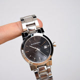  Shop Authentic Burberry The City Black Dial Silver Steel Strap Watch for Women - BU9101 - Luxxuri