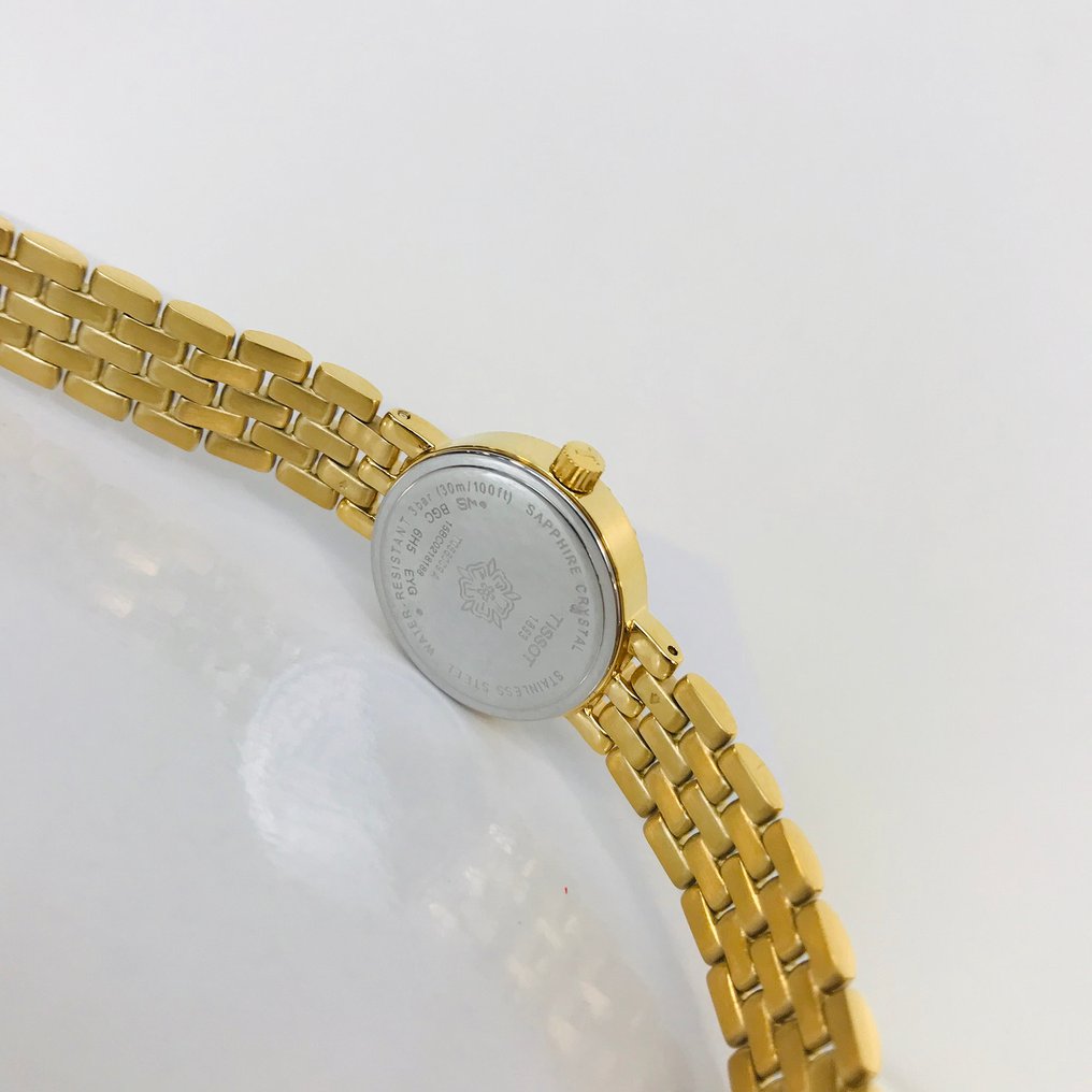  Shop Authentic Tissot T-Lady Lovely Mother of Pearl Dial Gold Steel Strap Watch For Women - T058.009.63.116.00 - Luxxuri