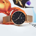  Shop Authentic Daniel Wellington Classic Melrose Black Dial Rose Gold Mesh Bracelet Watch For Women - DW00100161 - Luxxuri