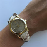  Shop Authentic Burberry The City Gold Dial Haymarket Brown Leather Strap Watch for Women - BU9219 - Luxxuri
