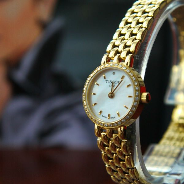  Shop Authentic Tissot T-Lady Lovely Mother of Pearl Dial Gold Steel Strap Watch For Women - T058.009.63.116.00 - Luxxuri