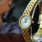  Shop Authentic Tissot T-Lady Lovely Mother of Pearl Dial Gold Steel Strap Watch For Women - T058.009.63.116.00 - Luxxuri