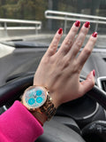  Shop Authentic Guess Mini Sunrise Multi Function Analog Turquoise Dial Rose Gold Steel Strap Watch For Women - W0448L8 - Luxxuri