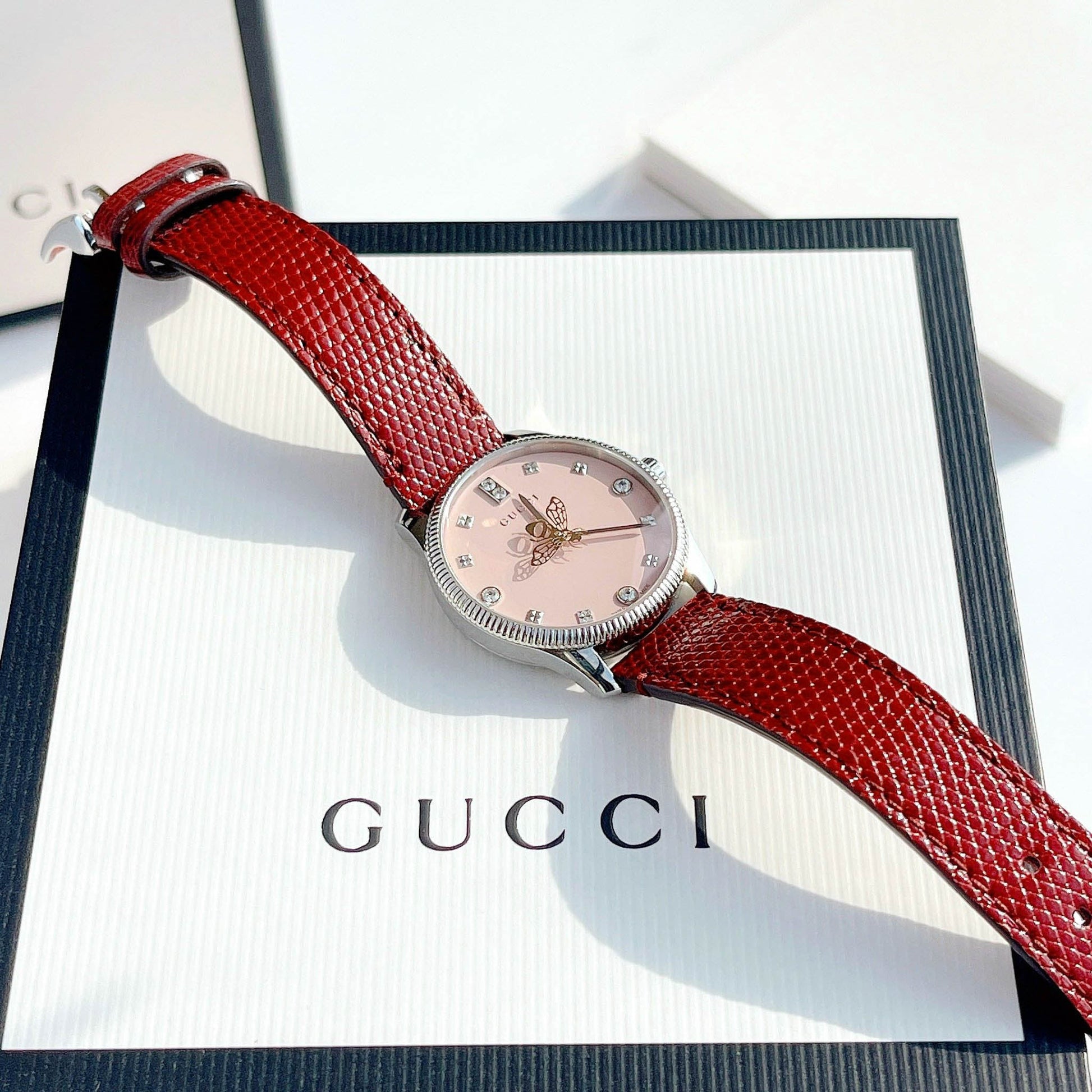  Shop Authentic Gucci G Timeless Quartz Diamonds Pink Dial Red Leather Strap Watch For Women - YA1265017 - Luxxuri