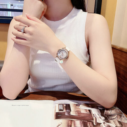  Shop Authentic Swarovski Crystalline Aura Silver Dial White Leather Strap Watch for Women - 5519453 - Luxxuri
