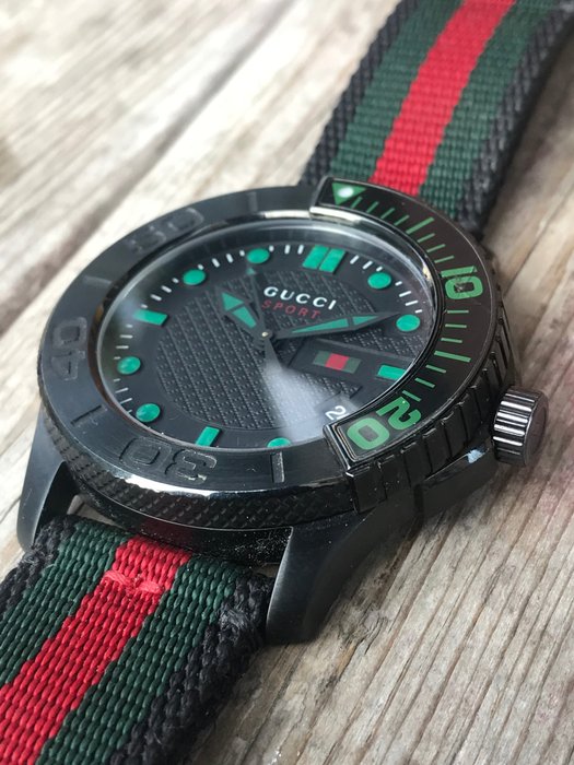  Shop Authentic Gucci G Timeless Sport Black Dial Two Tone NATO Strap Watch For Men - YA126229 - Luxxuri