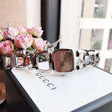  Shop Authentic Gucci G Brown Square Brown Dial Silver Steel Strap Watch For Women - YA125402 - Luxxuri