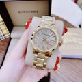  Shop Authentic Burberry The City Gold Dial Gold Steel Strap Watch for Women - BU9145 - Luxxuri