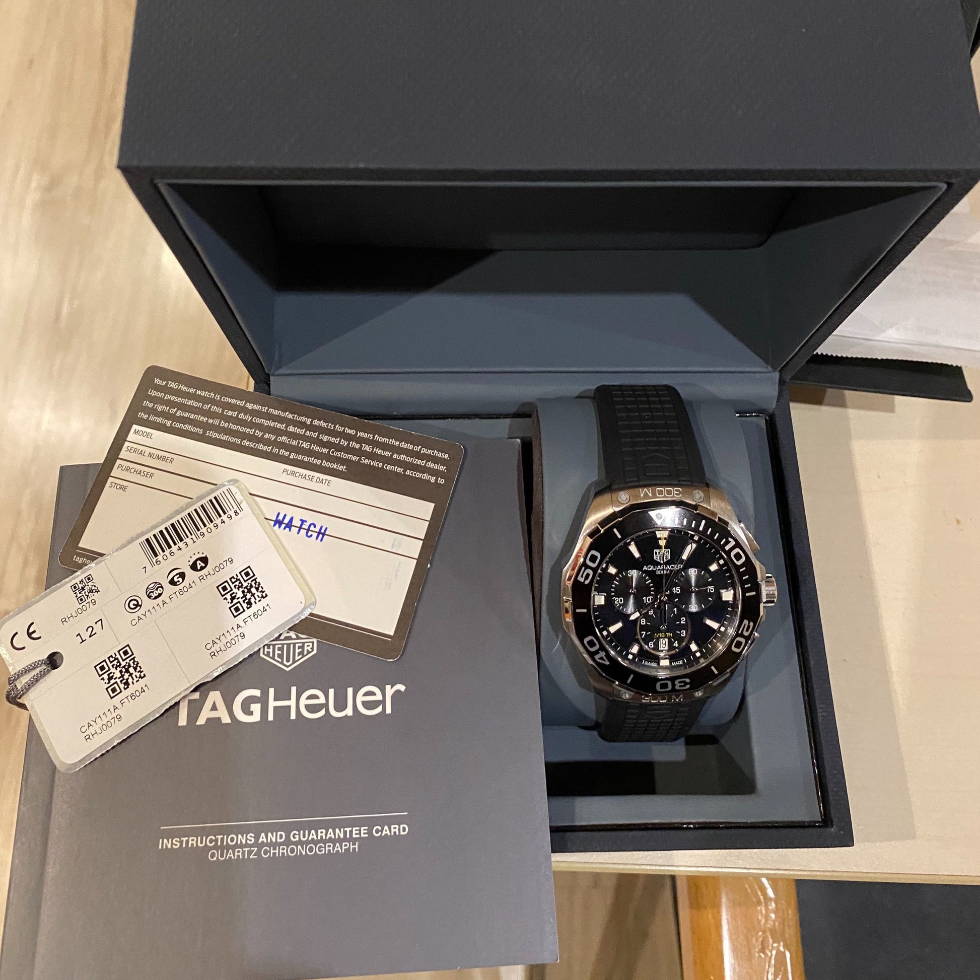  Shop Authentic Tag Heuer Carrera Aquaracer Quartz Chronograph Black Dial Black Rubber Strap Watch for Men - CAY111A.FT6041 - Luxxuri