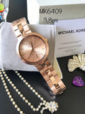  Shop Authentic Michael Kors Garner Quartz Rose Gold Dial Rose Gold Steel Strap Watch For Women - MK6409 - Luxxuri