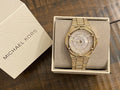  Shop Authentic Michael Kors Lennox Three Hand Crystals White Dial Gold Steel Strap Watch For Women - MK6991 - Luxxuri