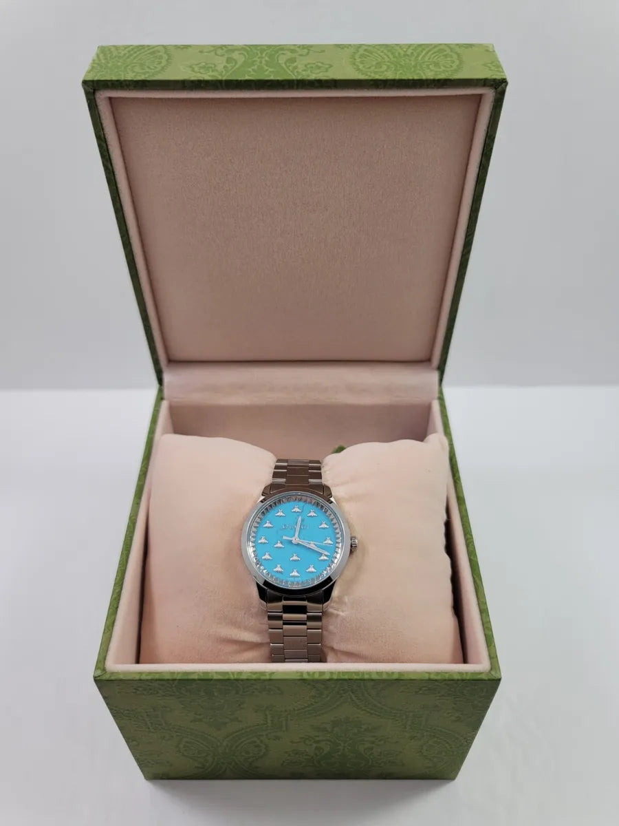 Shop Authentic Gucci G Timeless Quartz Turquoise Dial Silver Steel Strap Unisex Watch - YA1265044 - Luxxuri