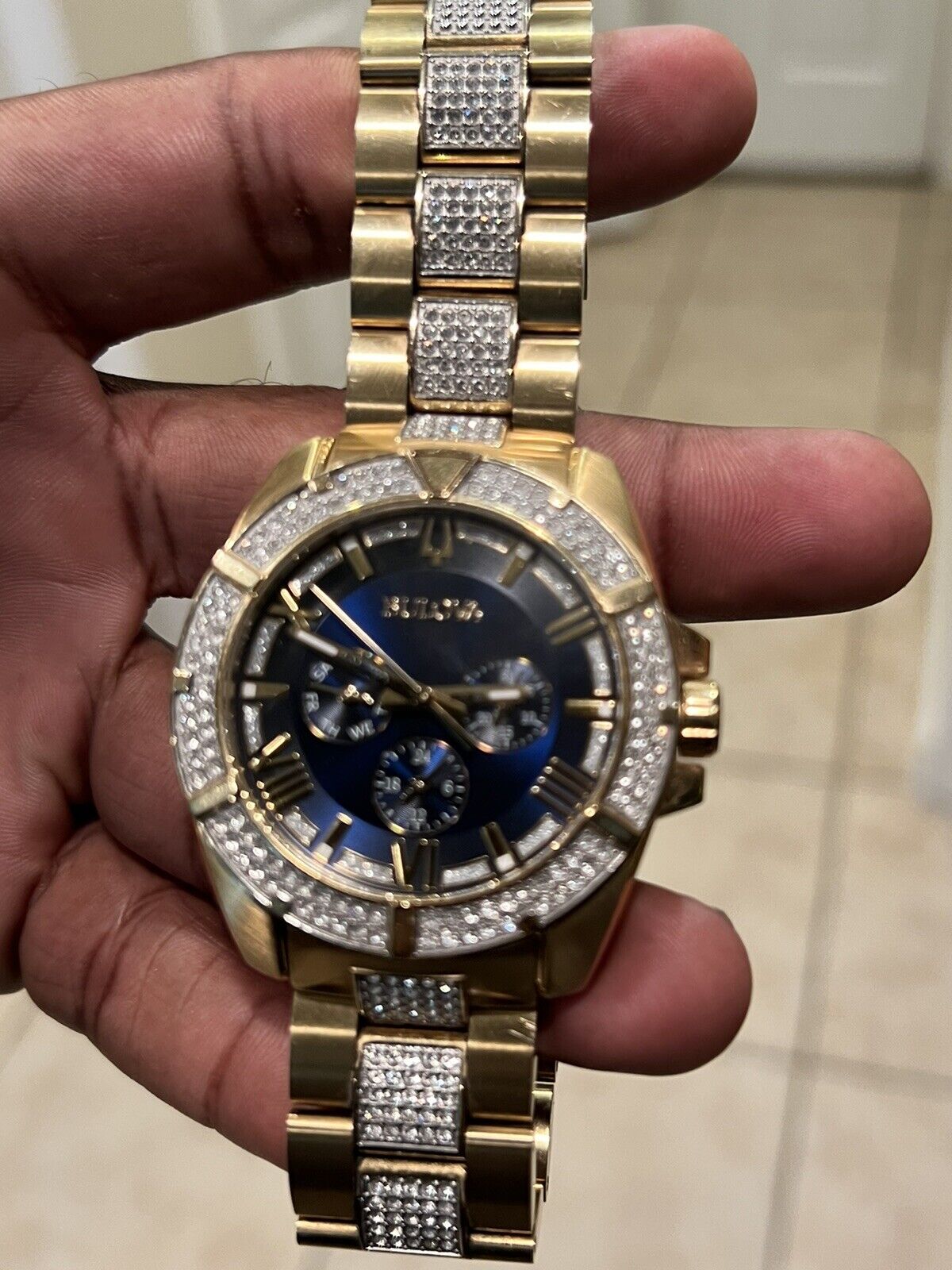  Shop Authentic Bulova Crystal Collection Blue Dial Gold Steel Strap Watch for Men - 98C128 - Luxxuri