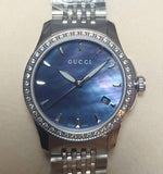  Shop Authentic Gucci G Timeless Diamonds Mother of Pearl Black Dial Silver Mesh Bracelet Watch For Women - YA126507 - Luxxuri