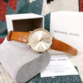  Shop Authentic Michael Kors Jaryn Quartz Gold Dial Brown Leather Strap Watch For Women - MK2496 - Luxxuri