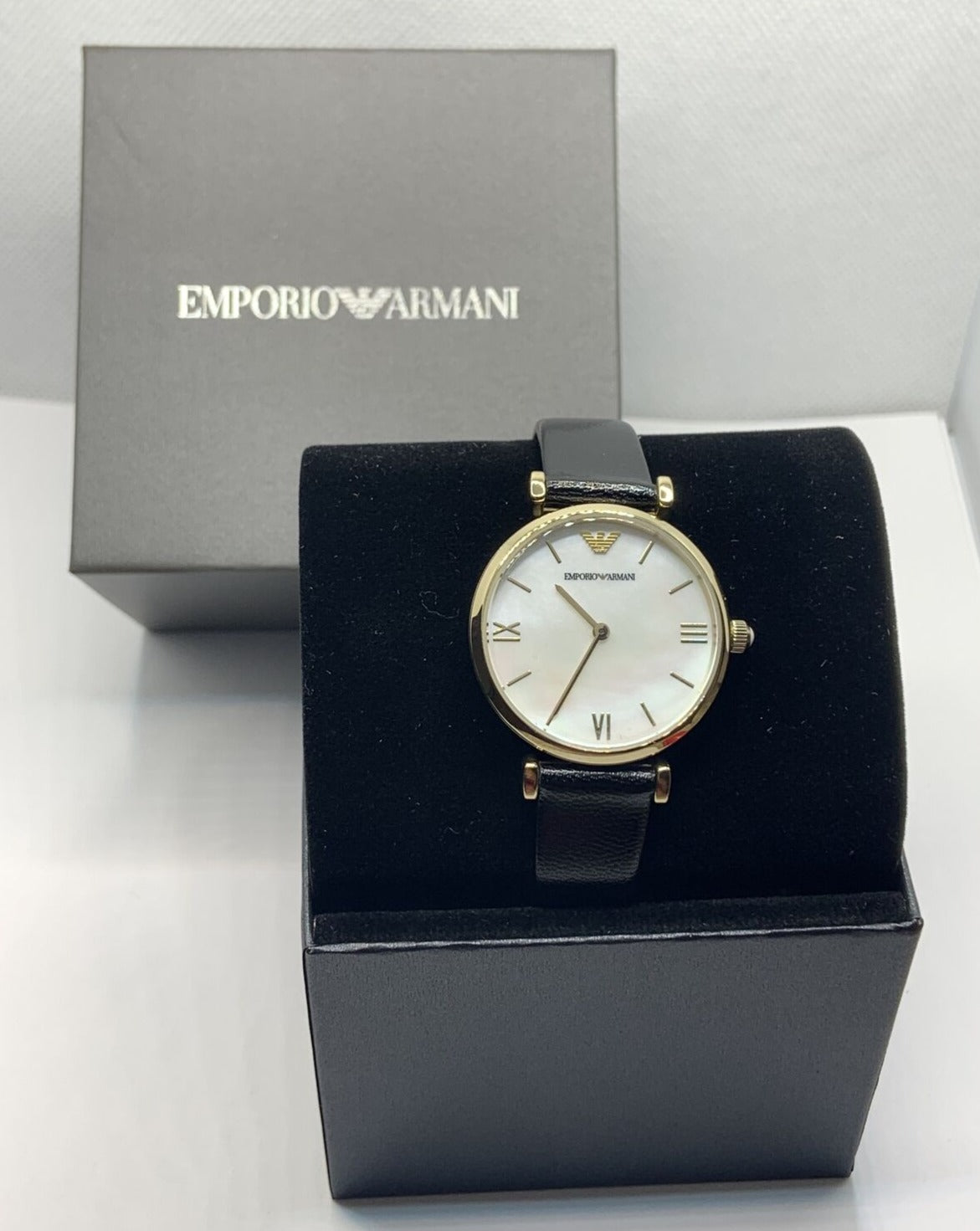  Shop Authentic Emporio Armani Gianni T-Bar Quartz Mother of Pearl Dial Black Leather Strap Watch For Women - AR1910 - Luxxuri