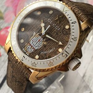  Shop Authentic Gucci Dive Doraemon Brown Dial Brown Leather Strap Watch For Men - YA136334 - Luxxuri