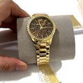 Shop Authentic Michael Kors Layton Chronograph Brown Dial Gold Steel Strap Watch For Women - MK7296 - Luxxuri