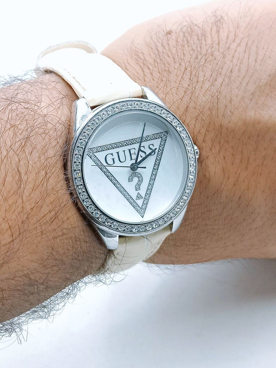  Shop Authentic Guess Mini Triangle Quartz Diamonds Silver Dial White Leather Strap Watch For Women - W65006L1 - Luxxuri