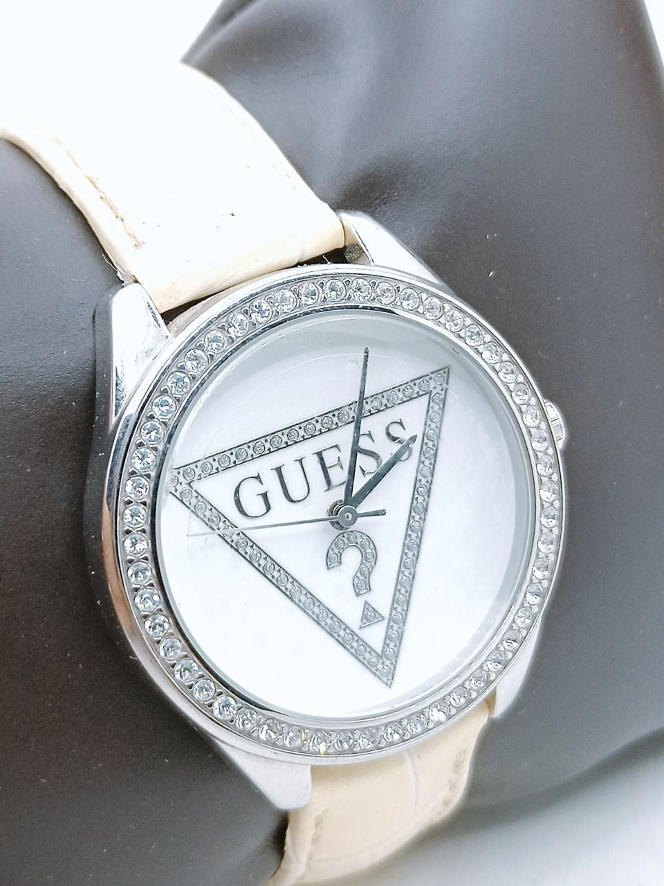  Shop Authentic Guess Mini Triangle Quartz Diamonds Silver Dial White Leather Strap Watch For Women - W65006L1 - Luxxuri