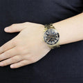 Guess BFF Multifunction Black Dial Gold Steel Strap Watch for Women - W0231L3