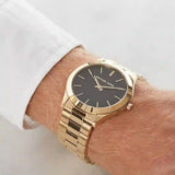  Shop Authentic Michael Kors Slim Runway Quartz Black Dial Gold Steel Strap Watch For Men - MK8621 - Luxxuri